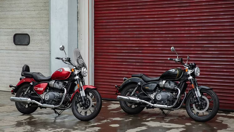 Two motorcycles parked in a garage  Description automatically generated with low confidence